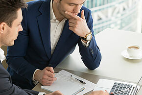 Entrepreneurs discussing work results on meeting