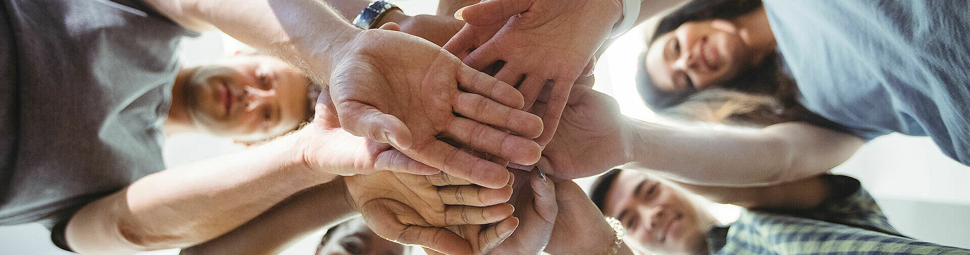 Business executives with hand stacked